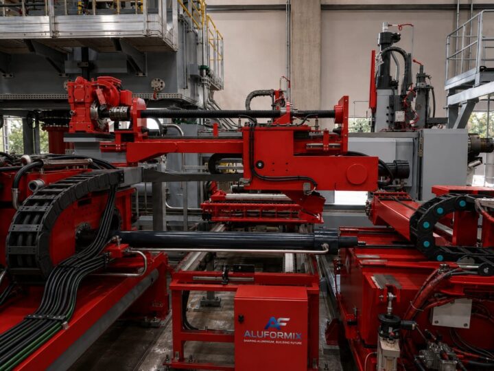 ALUFORMIX robotic billet loader cell combining billet shear, gauge, transfer, positioning pusher and robotic arm